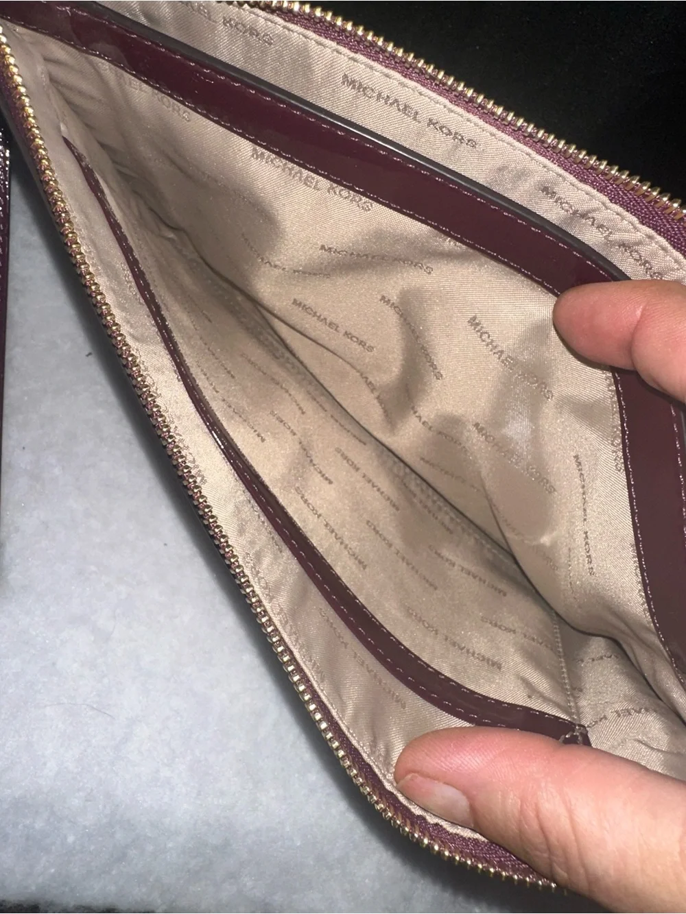 Michael Kors wristlet logo finish
